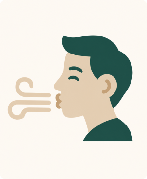man blowing air